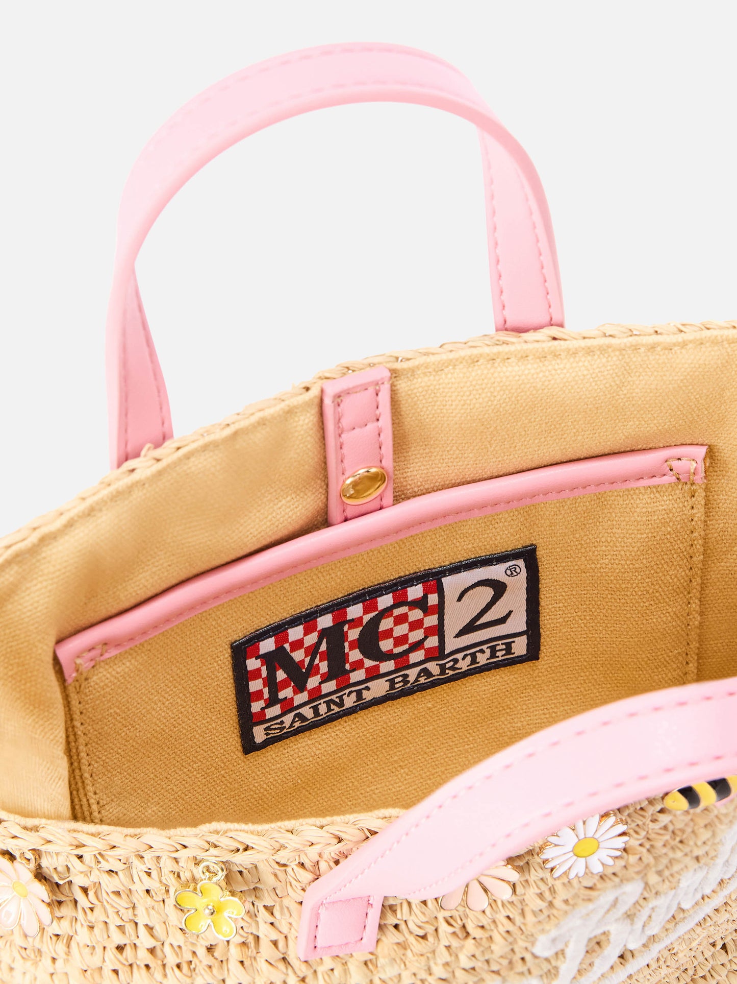 City mini raffia bag with applied charms and embroidered logo