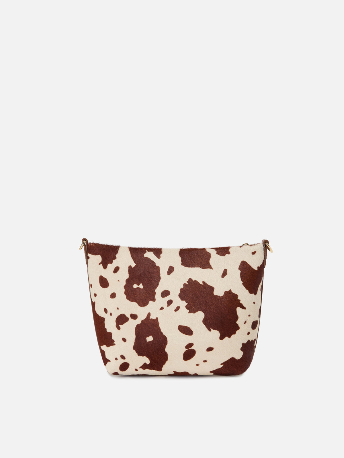 Bolso Aline en pony hair con estampado de vaca y placa con logo de metal 