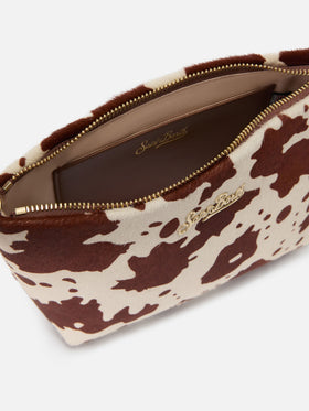 Bolso Aline en pony hair con estampado de vaca y placa con logo de metal 