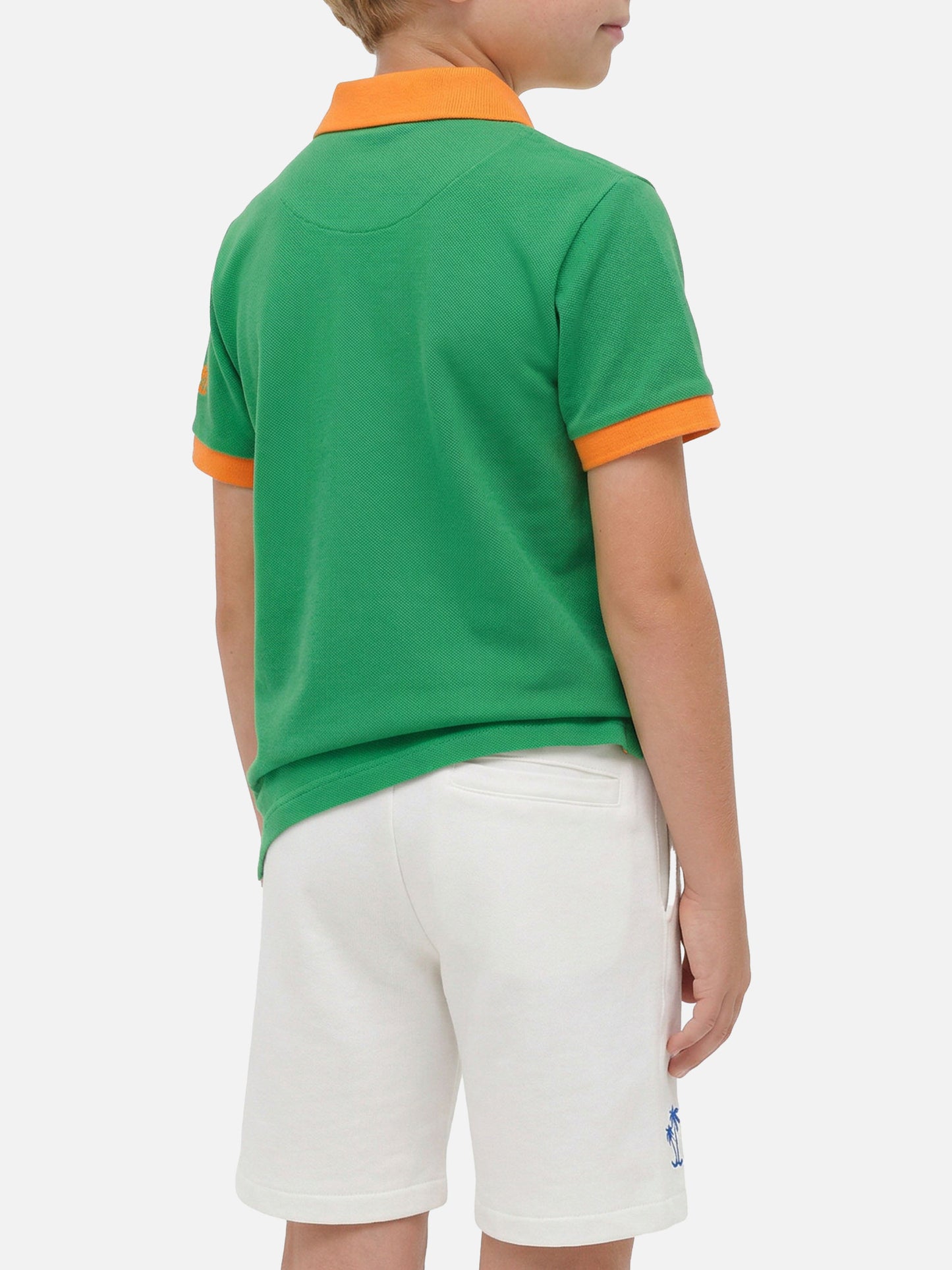 Boy green piquet polo with orange St. Barth logo