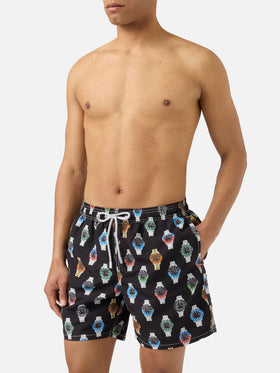 Gustavia swim shorts in solid black with watch print