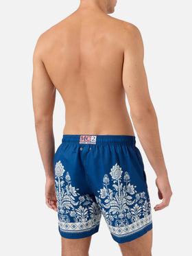 Gustavia blue swim shorts with ornamental floral print
