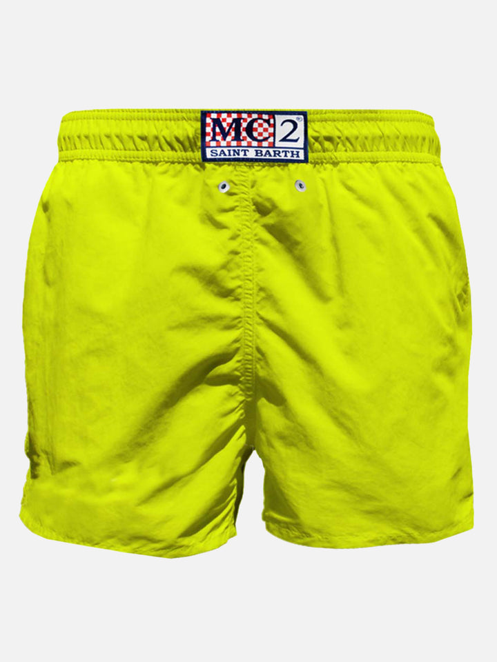 Mid-length swim shorts with skull flag placed print