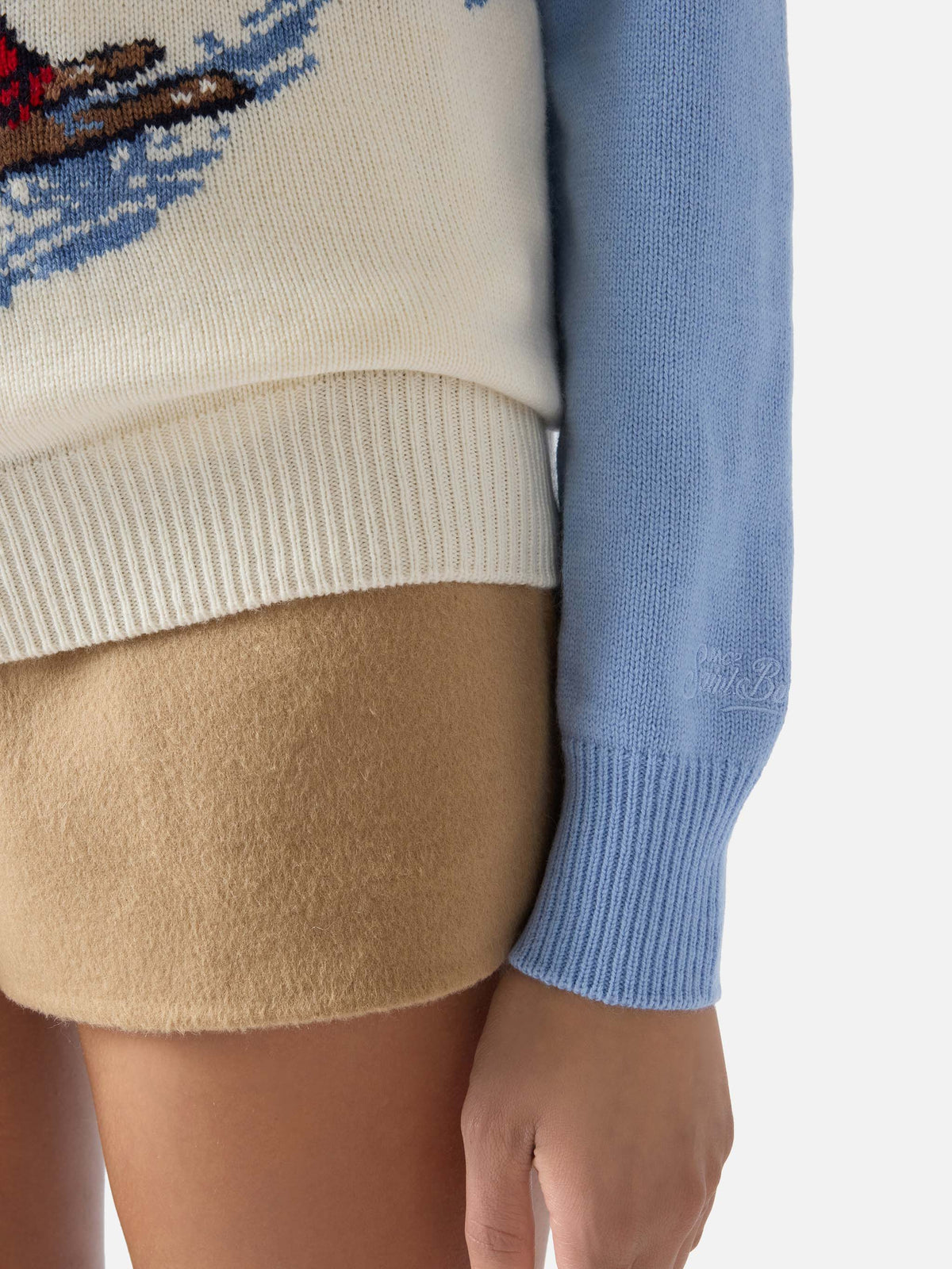 Light blue New Queen crewneck knit with Mi Fai Volare embroidery