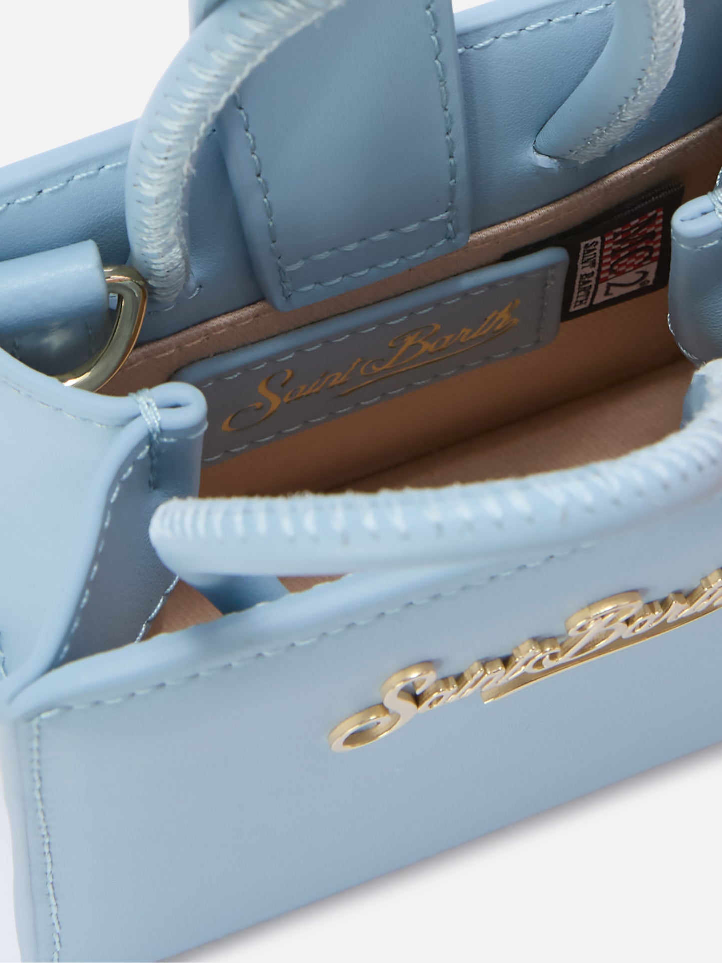 Structured Shop micro bag in light blue smooth leather with metal tag