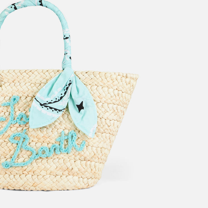 Strohtasche mit Stickerei vorne und Stoffgriffen