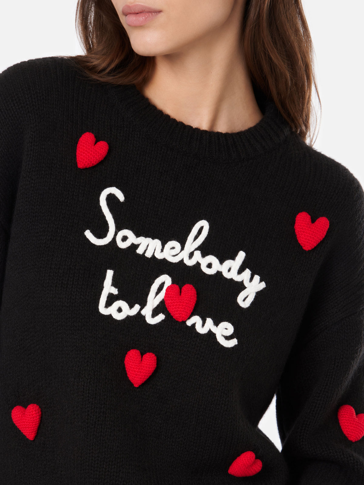 Danya Soft black sweater with Somebody to love embroidery and crochet hearts